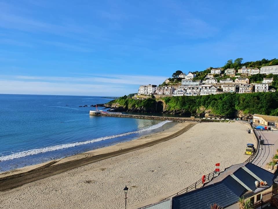 Looe Bay - see Clipper House top right of this photo built into the rockface overlooking Looe Bay